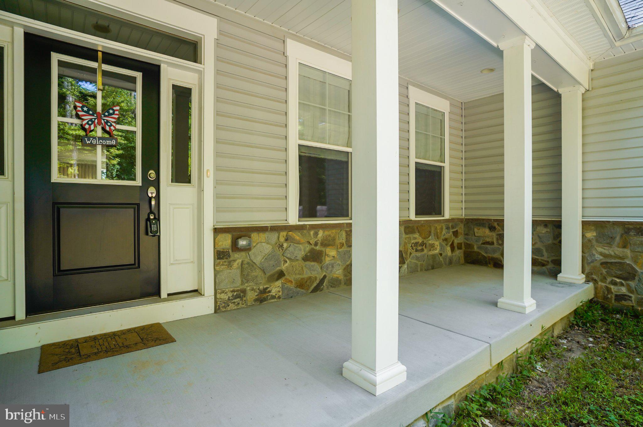 4755 South Polling House Road Harwood, MD 20776 - Photo 1 of 36 Charming entryway with stone accents.