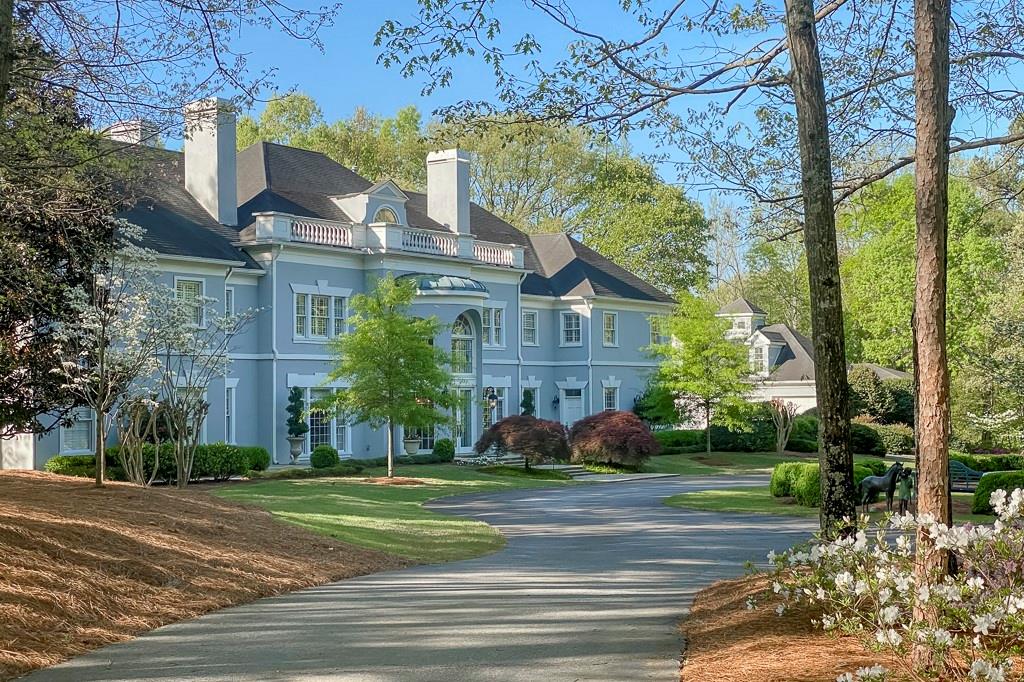 a view of a building with a yard