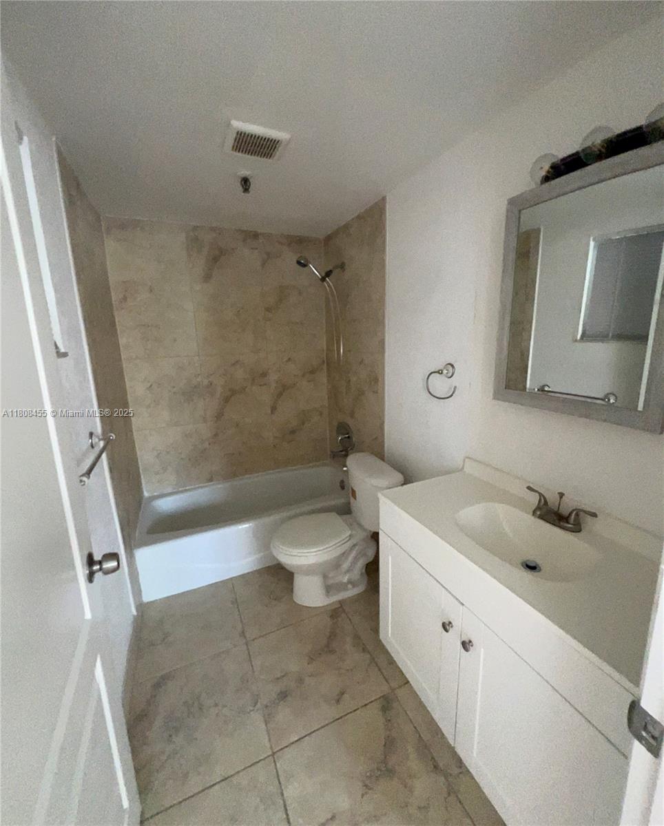 677 Northeast 24th Street, Unit 607 Miami, FL 33137 - Photo 15 of 29 a bathroom with a sink a toilet and shower