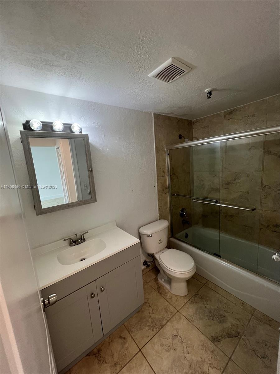 677 Northeast 24th Street, Unit 607 Miami, FL 33137 - Photo 17 of 29 a bathroom with a sink toilet and shower