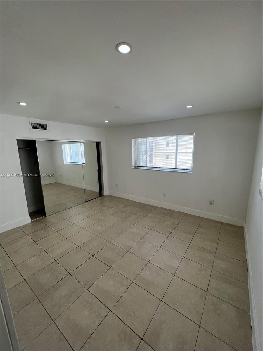 677 Northeast 24th Street, Unit 607 Miami, FL 33137 - Photo 23 of 29 an empty room with windows