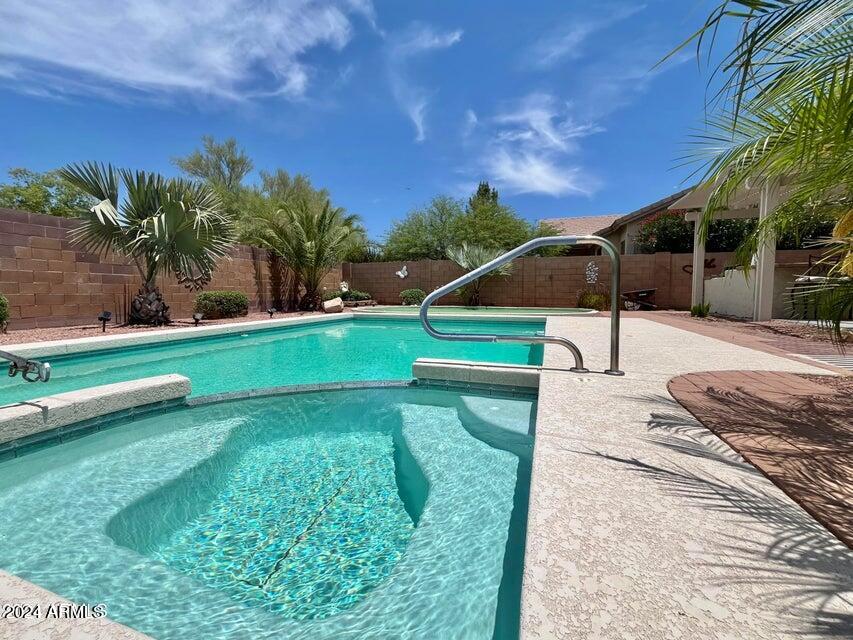 16908 West Northampton Road Surprise, AZ 85374 - Photo 2 of 13 a view of a backyard with swimming pool