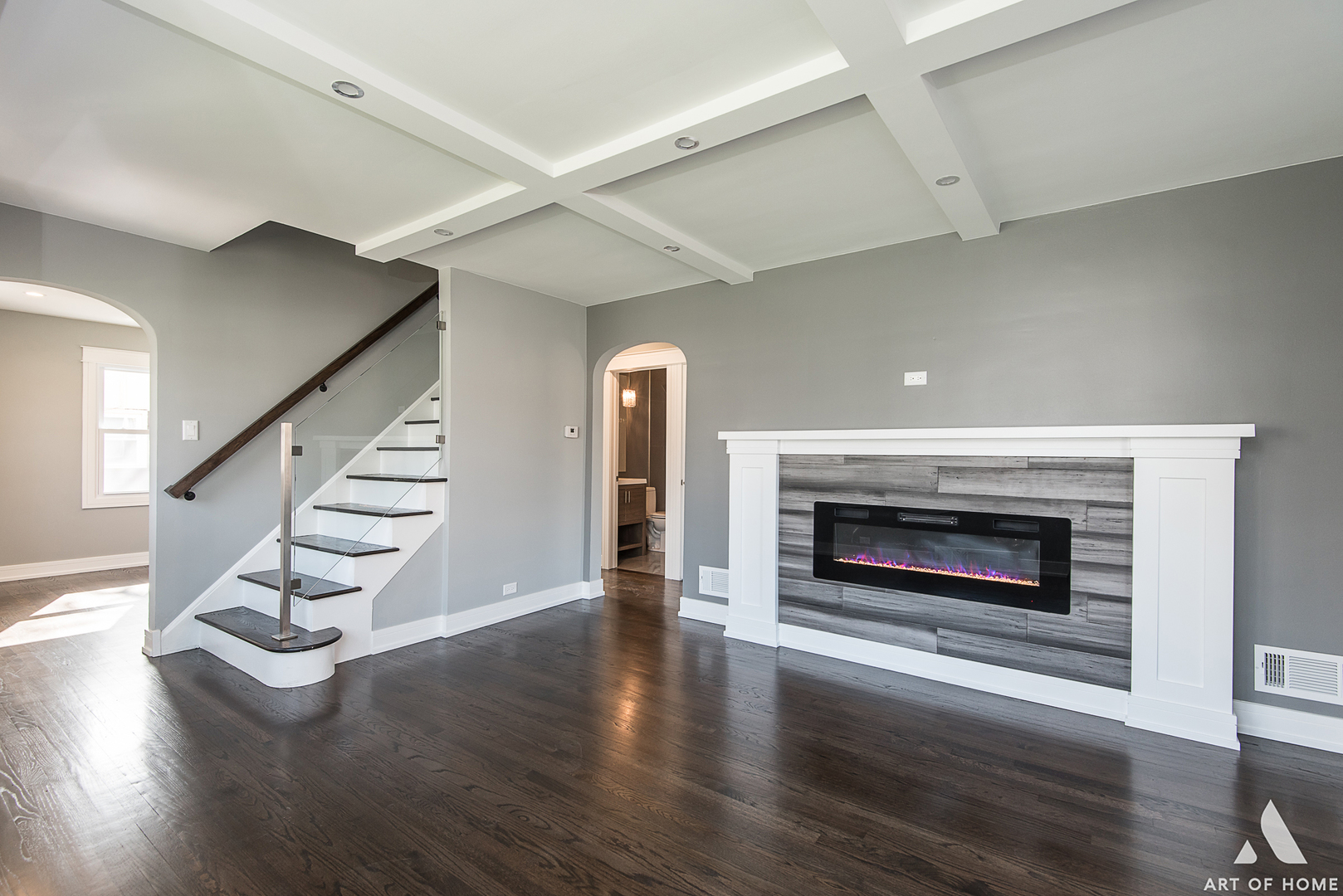 1447 Linden Road Homewood, IL 60430 - Photo 2 of 18 an empty room with wooden floor fireplace and stairs