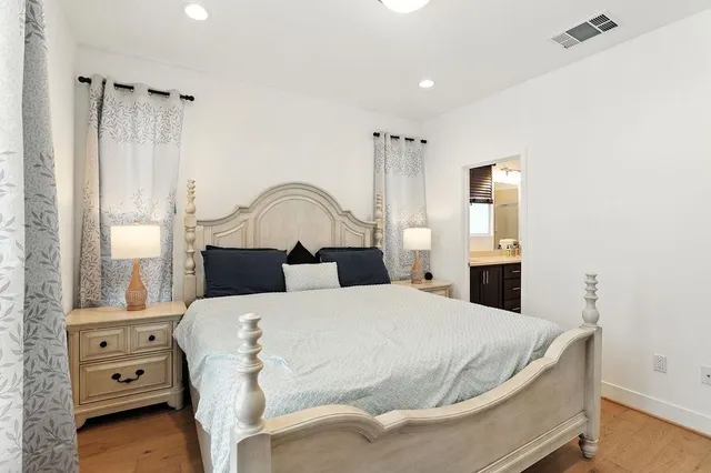 a bedroom with a bed and a dresser