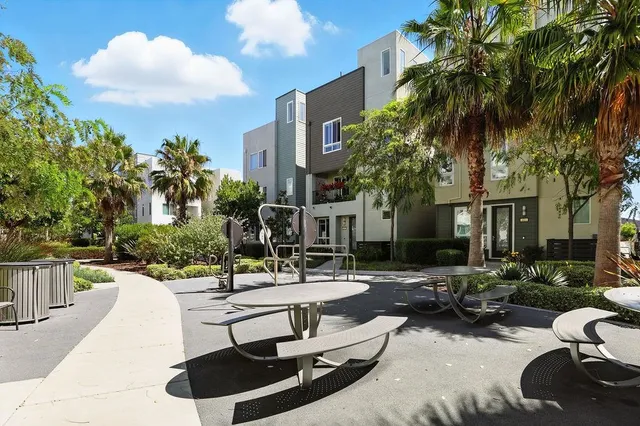 a swimming pool with outdoor seating and yard