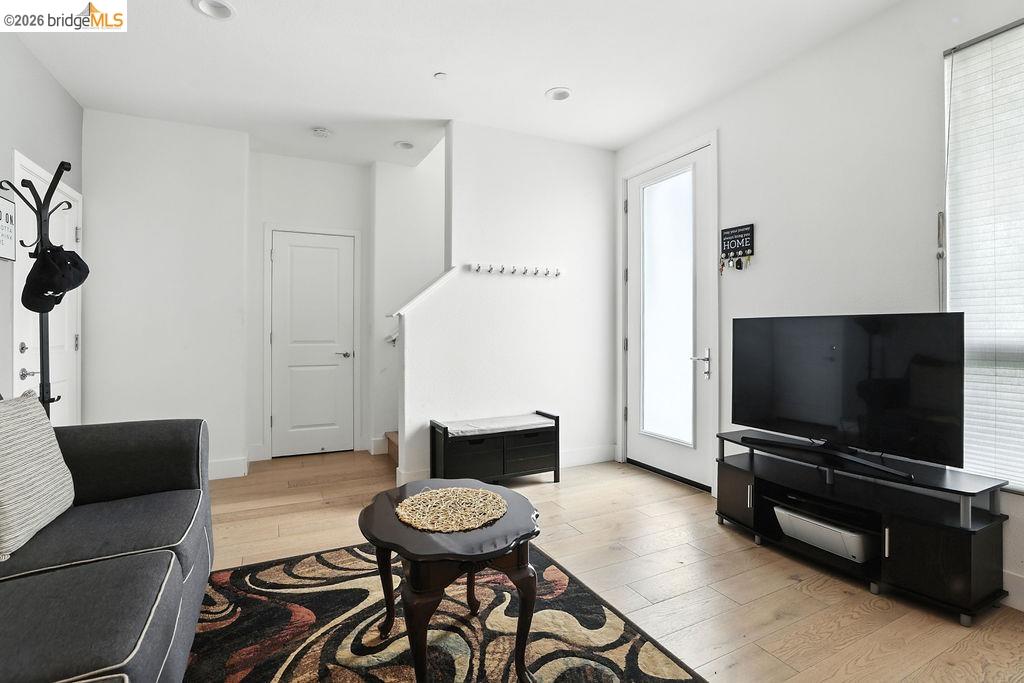 863 Lookout Street Richmond, CA 94804 - Photo 5 of 42 Living room with light wood finished floors and recessed lighting