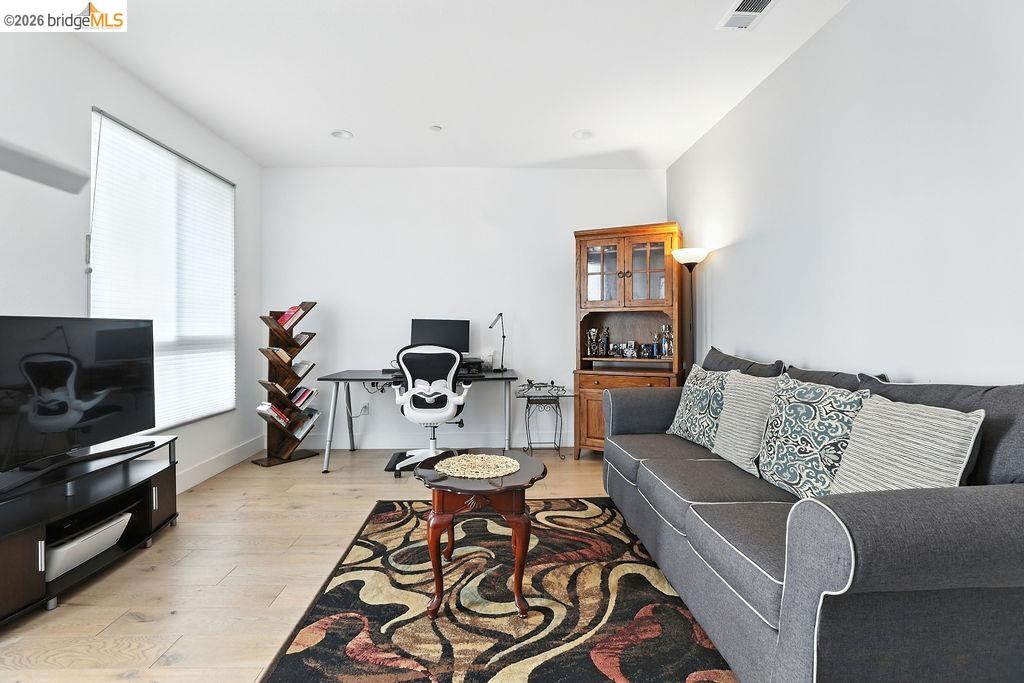 863 Lookout Street Richmond, CA 94804 - Photo 6 of 42 Living room with a desk and light wood-style flooring