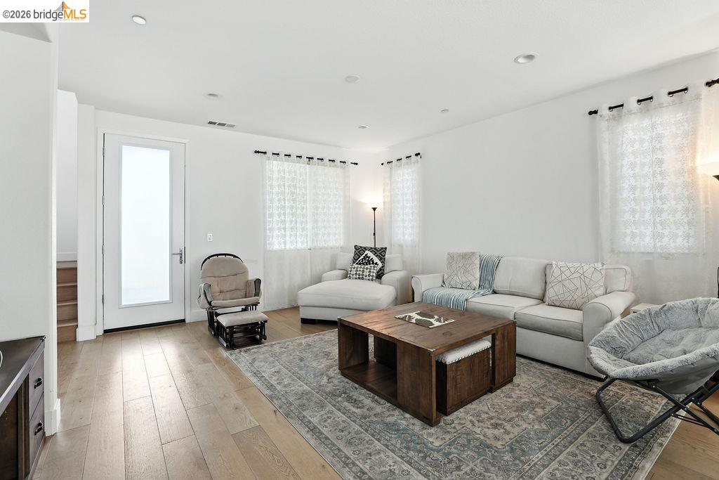 863 Lookout Street Richmond, CA 94804 - Photo 10 of 42 Living area with light wood-style floors and recessed lighting