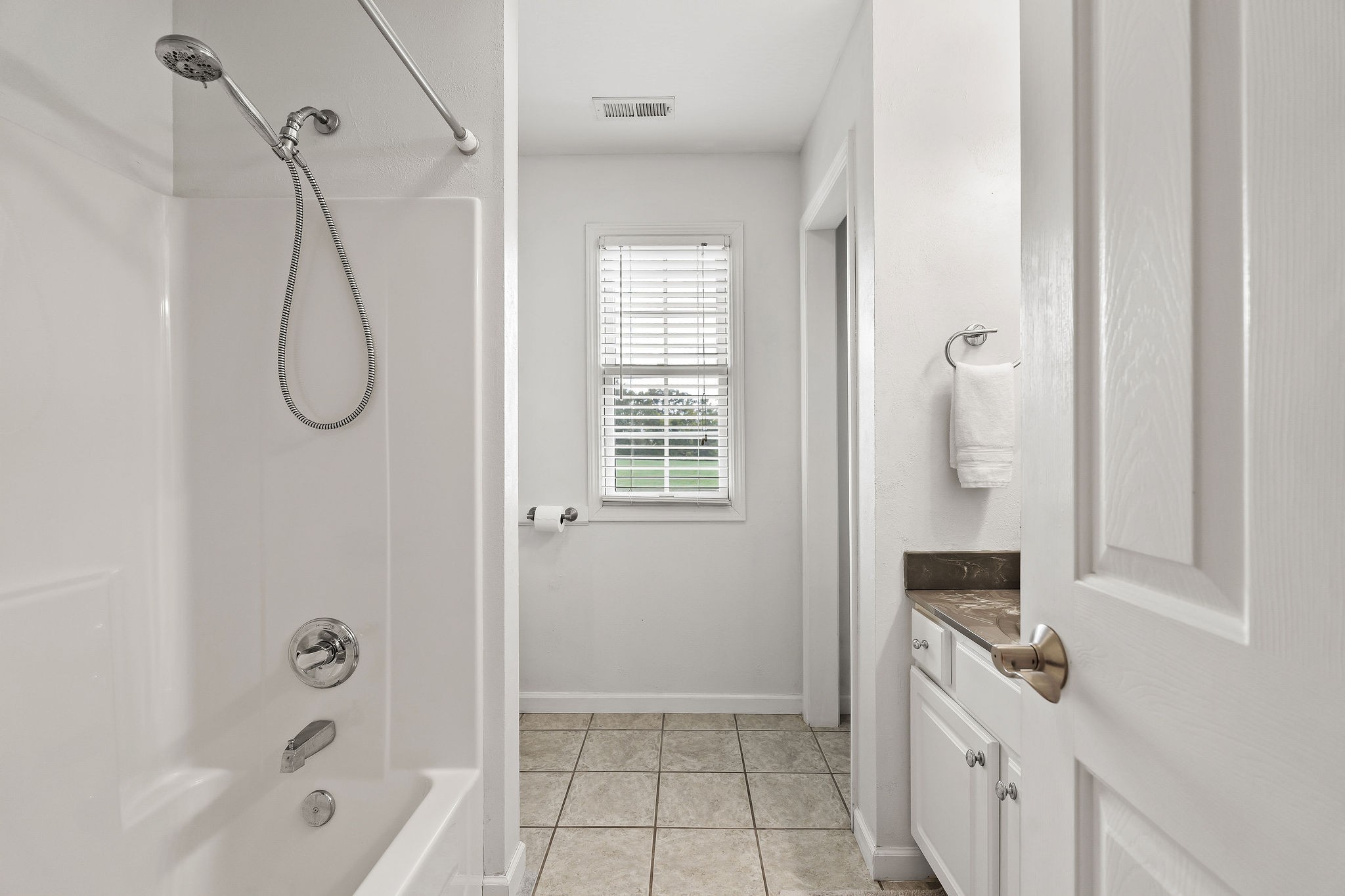 1151 Ball Park Road Morrison, TN 37357 - Photo 36 of 57 a bathroom with a granite countertop shower a mirror and a sink