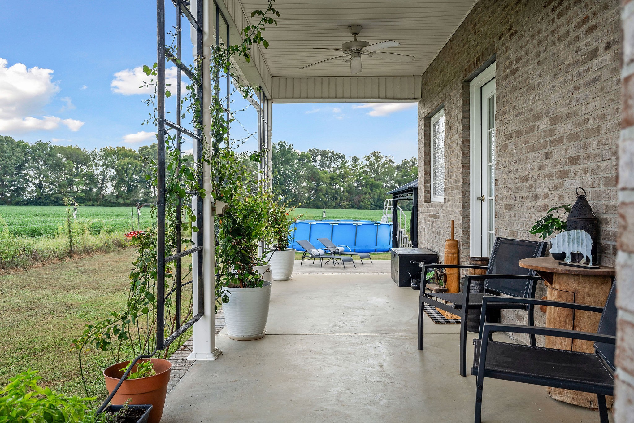 1151 Ball Park Road Morrison, TN 37357 - Photo 54 of 57 a balcony with chairs and a potted plant