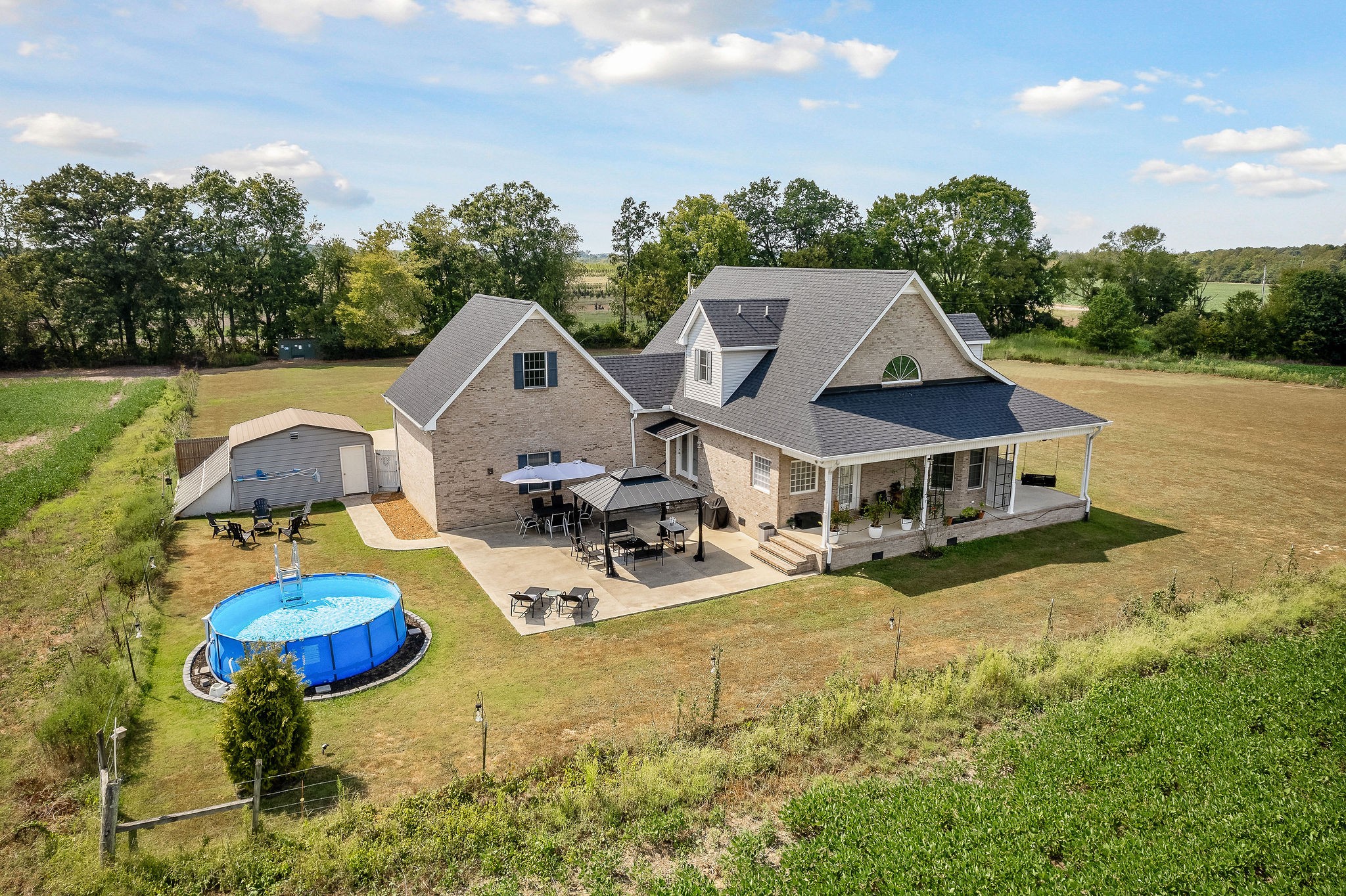 1151 Ball Park Road Morrison, TN 37357 - Photo 6 of 57 an aerial view of a house with swimming pool and large trees