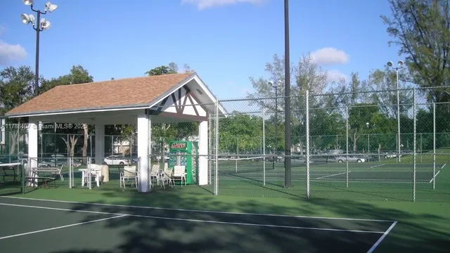 a view of a park that has a lots of windows and plants