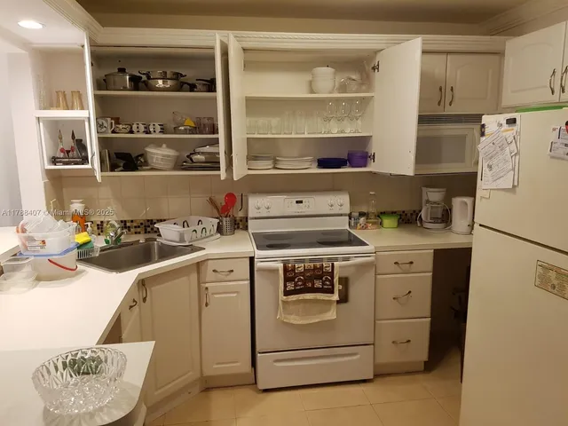 a kitchen with a stove and a refrigerator