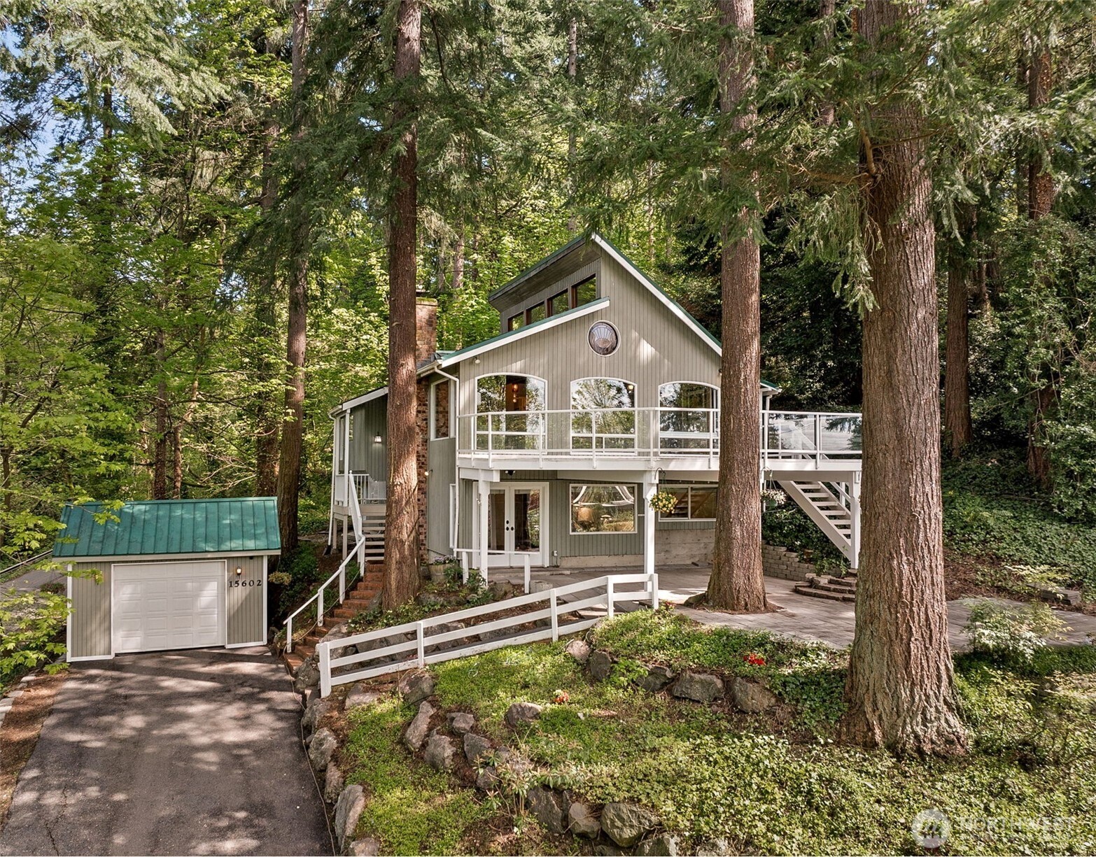 a view of a house with a yard balcony and sitting area