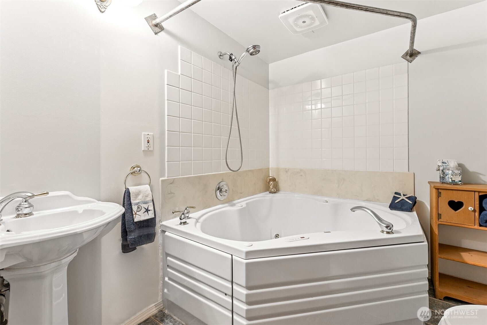 15602 26th Avenue Southwest Burien, WA 98166 - Photo 14 of 27 a white bath tub sitting next to a white sink