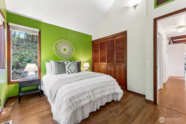 a bedroom with a bed and a window