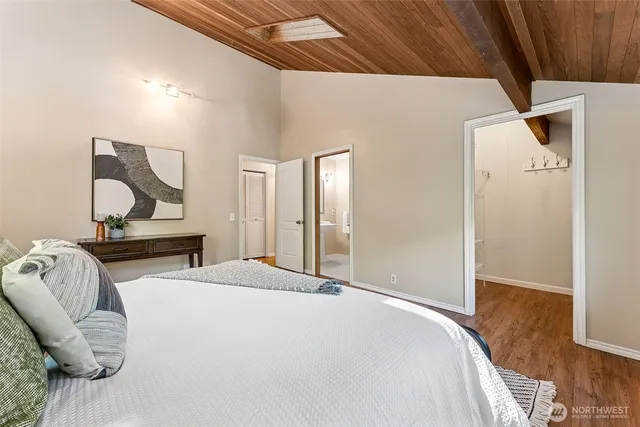 a bedroom with bed and window