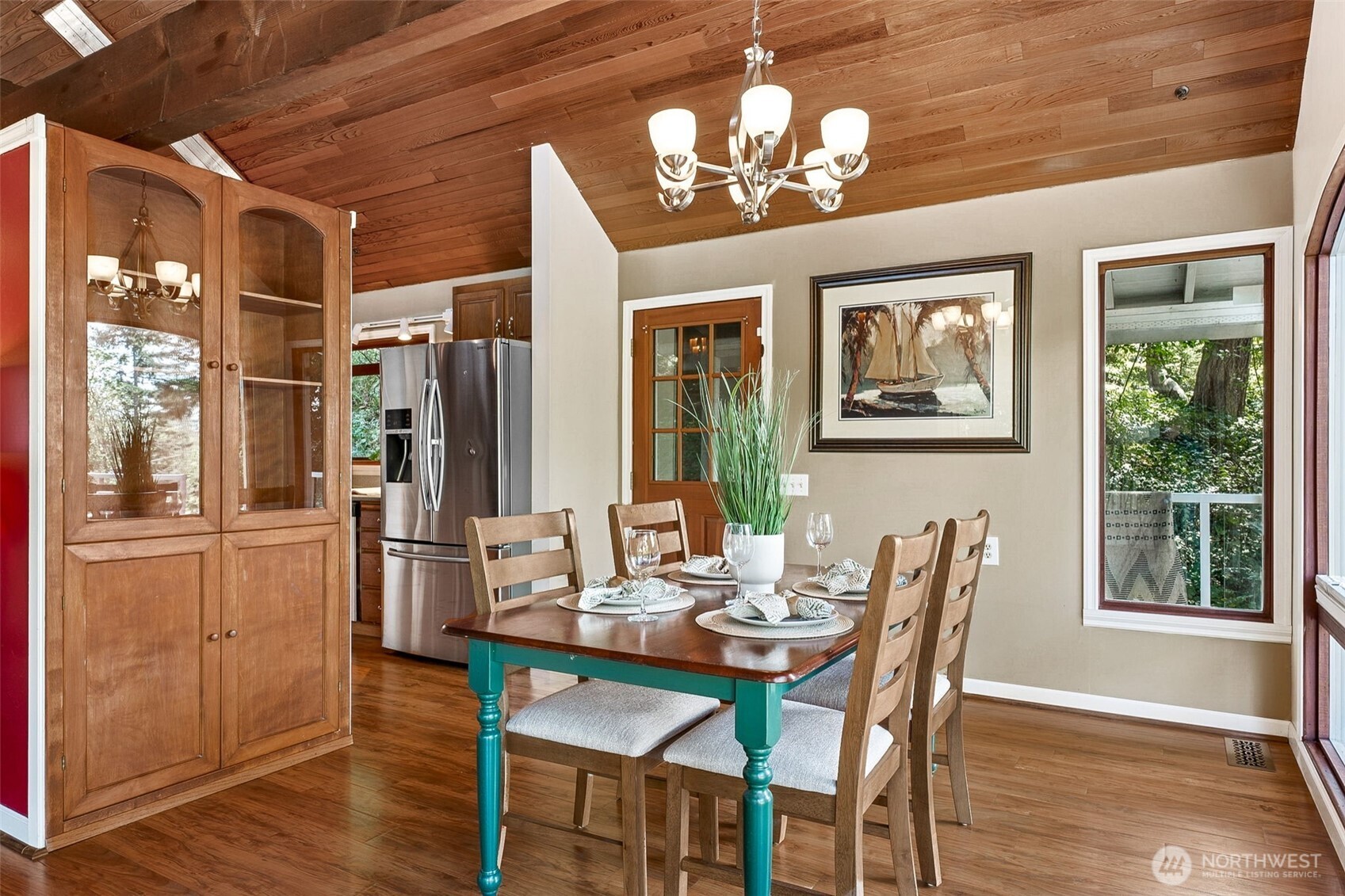 15602 26th Avenue Southwest Burien, WA 98166 - Photo 7 of 27 a view of a dining room with furniture wooden floor and chandelier