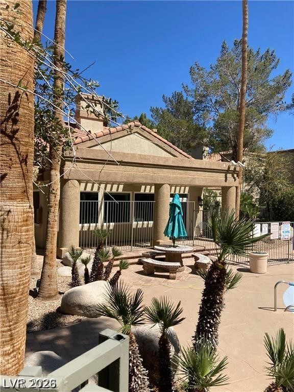 3145 East Flamingo Road, Unit 2100 Las Vegas, NV 89121 - Photo 31 of 34 A tranquil outdoor area boasts a stylish patio with seating, ideal for relaxation and entertaining.