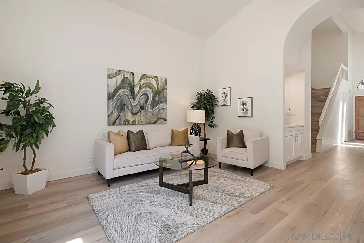 4256 Caminito Terviso San Diego, CA 92122 - Photo 11 of 32 a living room with furniture and a potted plant