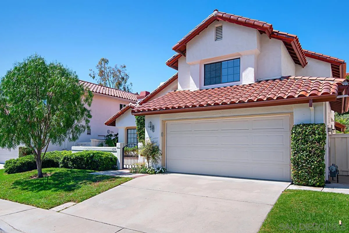 4256 Caminito Terviso San Diego, CA 92122 - Photo 2 of 32 a front view of a house with a yard