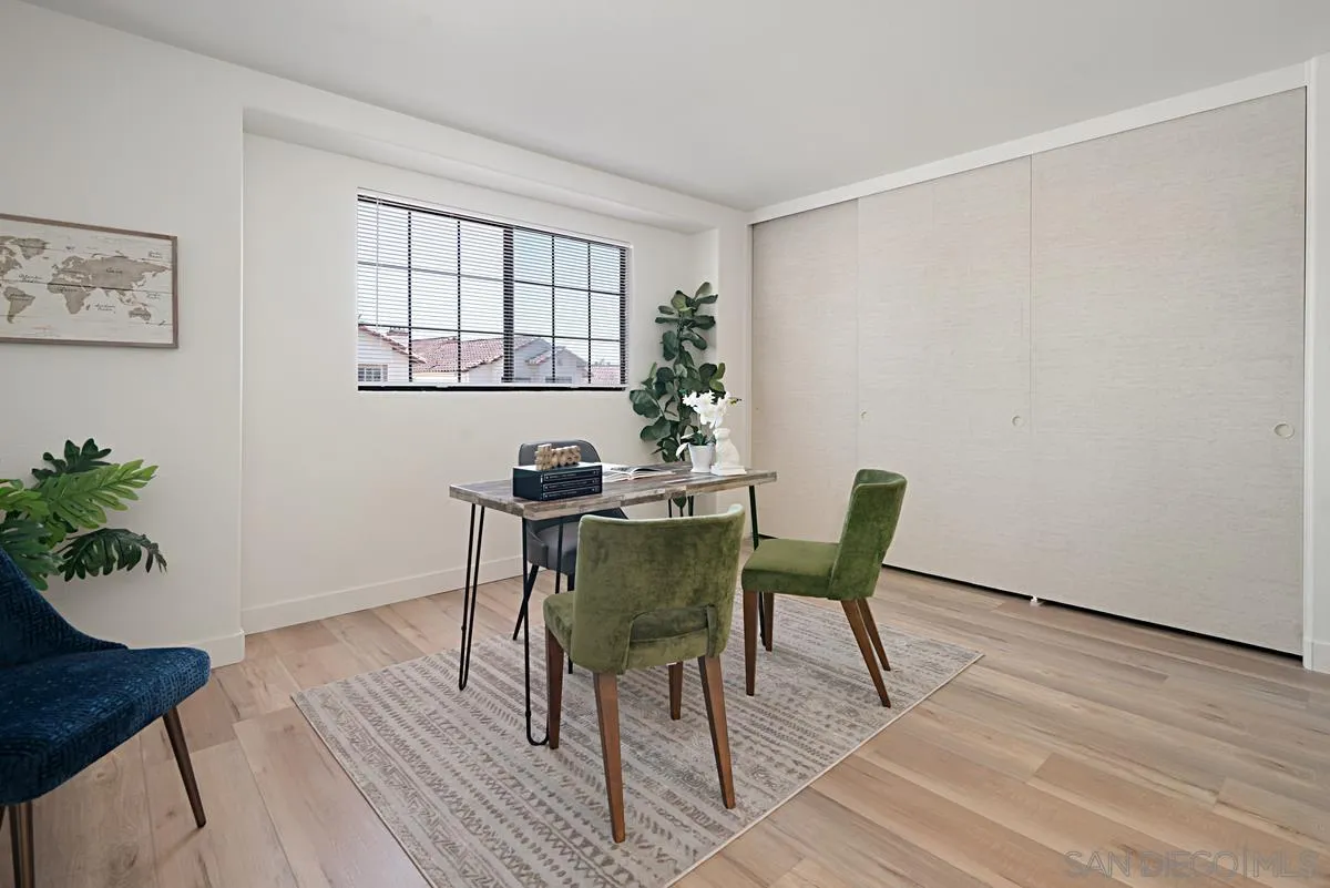 4256 Caminito Terviso San Diego, CA 92122 - Photo 23 of 32 a view of a dining room with furniture and wooden floor