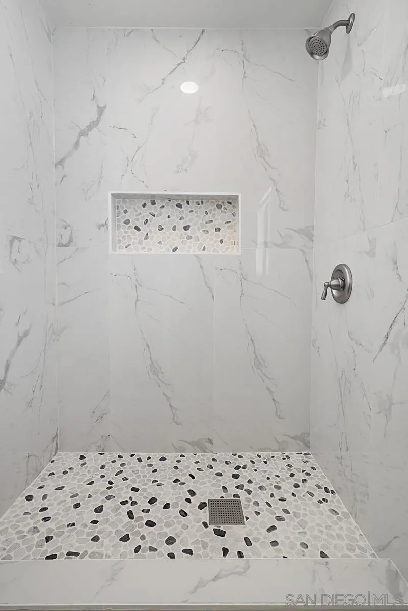 4256 Caminito Terviso San Diego, CA 92122 - Photo 25 of 32 a bathroom with a shower