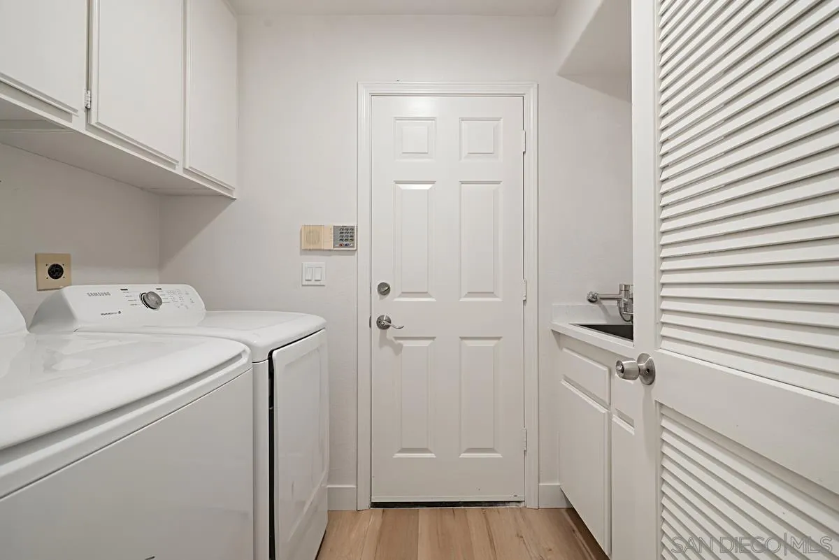 4256 Caminito Terviso San Diego, CA 92122 - Photo 27 of 32 a view of a storage & utility room with a washer dryer