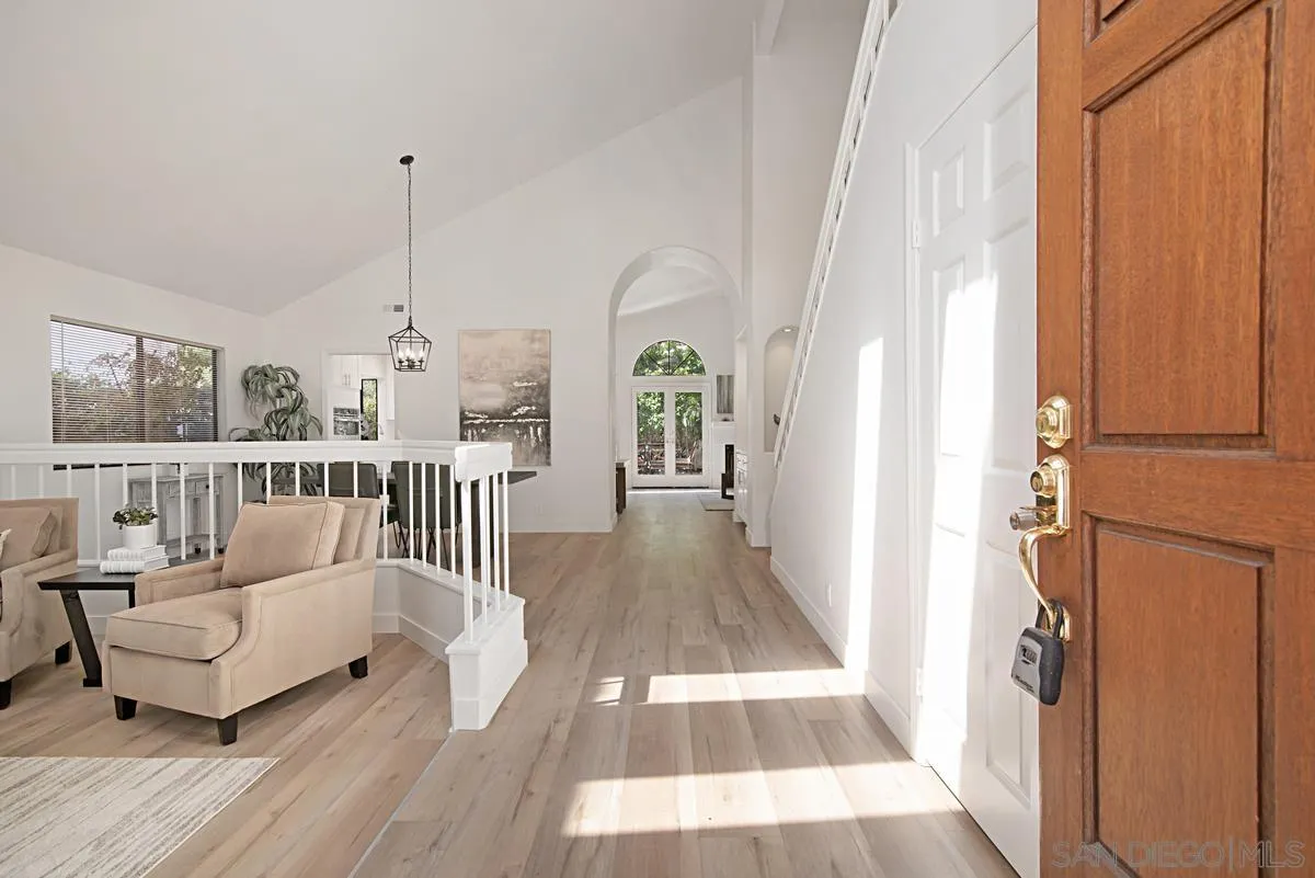 4256 Caminito Terviso San Diego, CA 92122 - Photo 4 of 32 a view of a living room with furniture and wooden floor