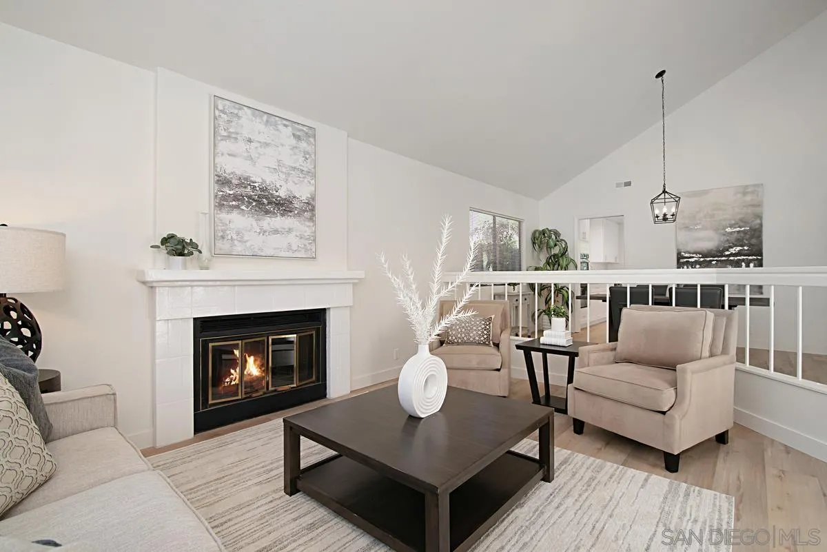 4256 Caminito Terviso San Diego, CA 92122 - Photo 5 of 32 a living room with furniture and a fireplace