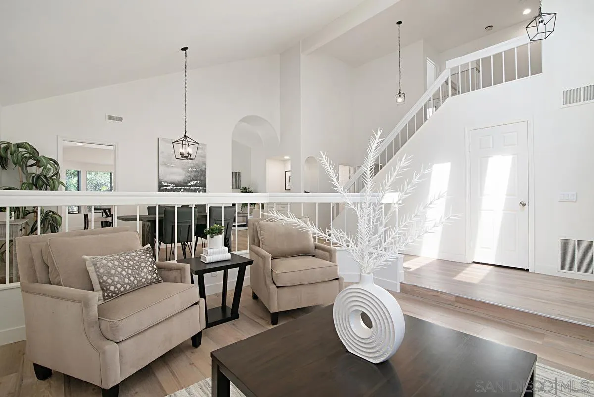 4256 Caminito Terviso San Diego, CA 92122 - Photo 6 of 32 a living room with furniture and a chandelier