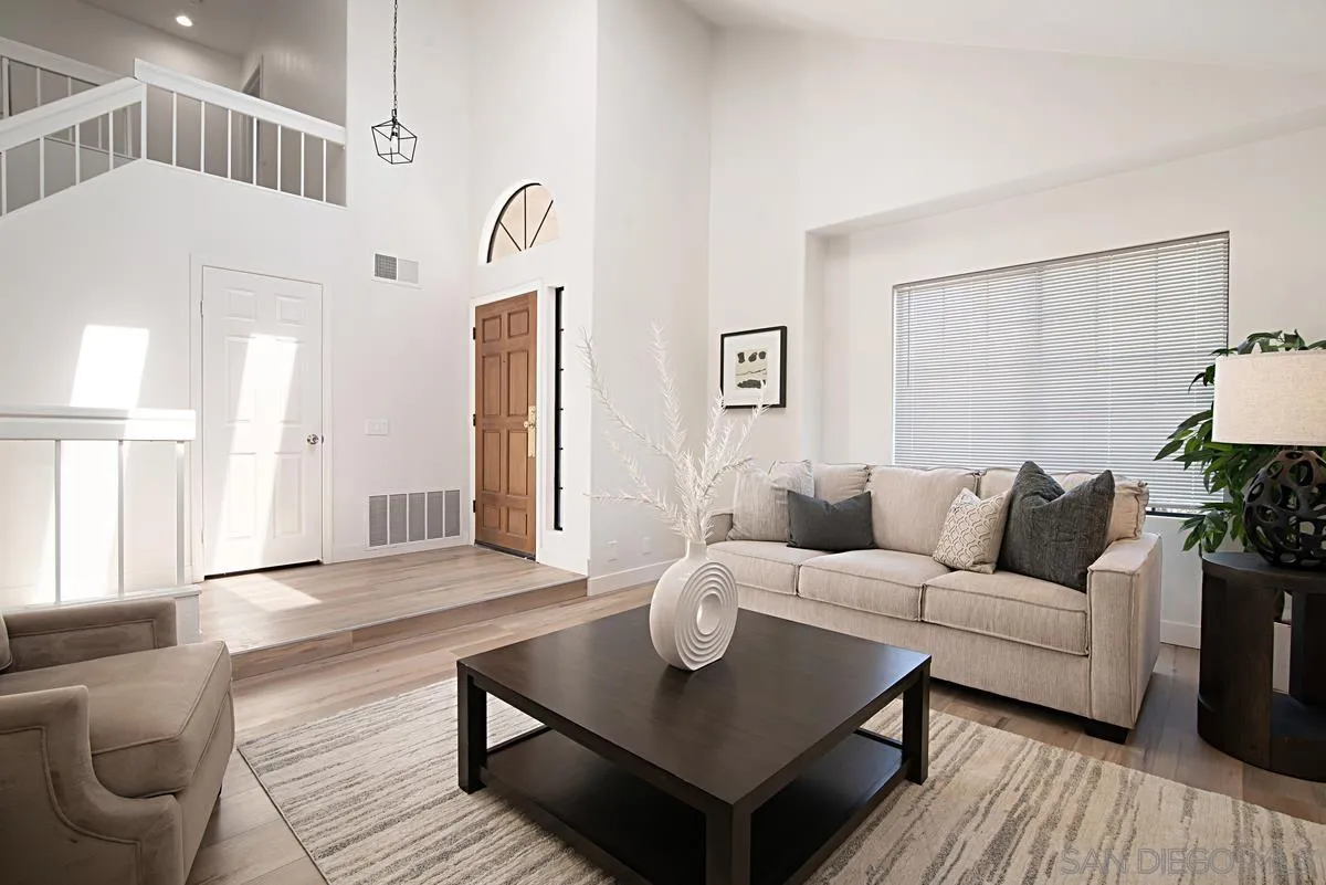 4256 Caminito Terviso San Diego, CA 92122 - Photo 7 of 32 a living room with furniture and a table