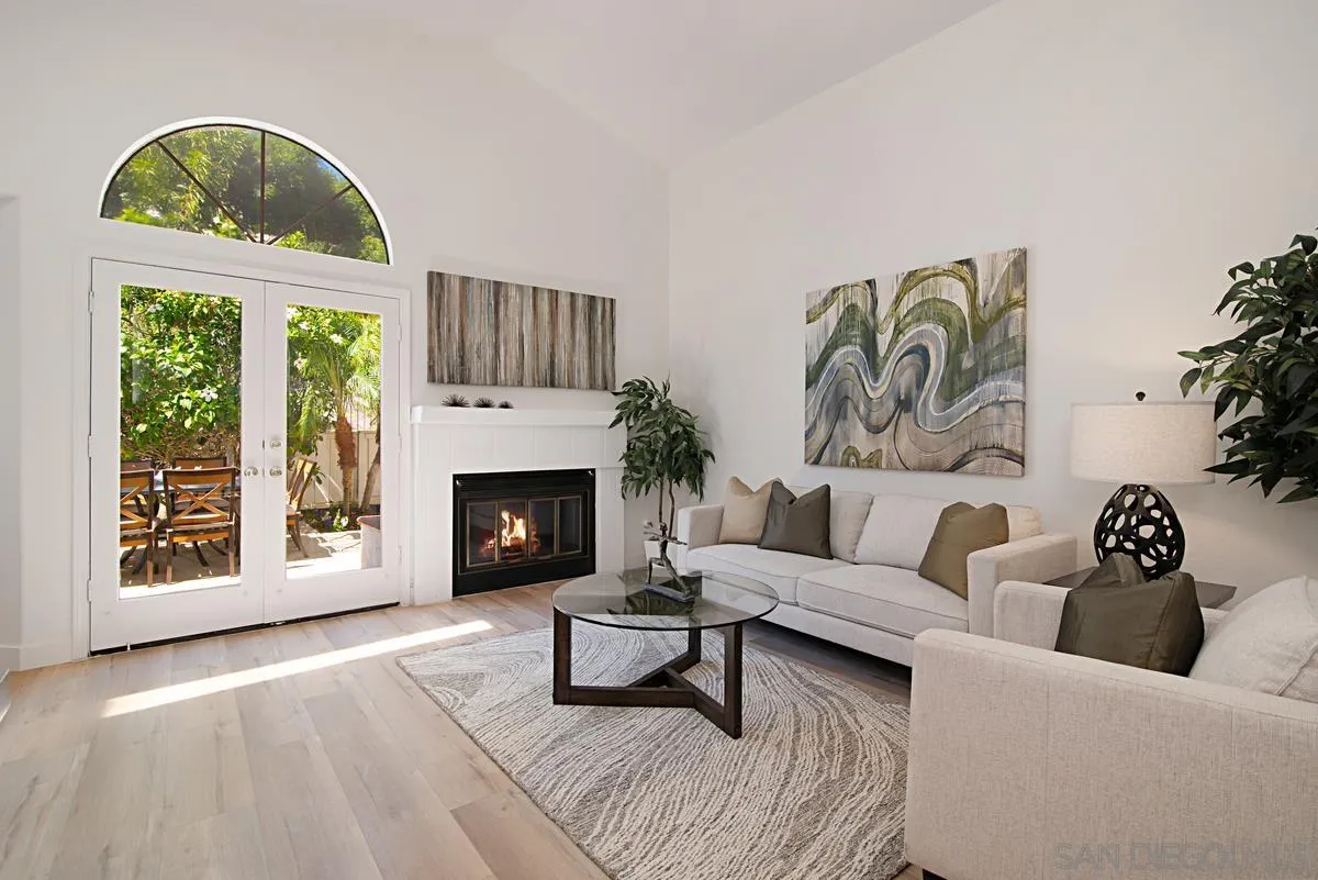 4256 Caminito Terviso San Diego, CA 92122 - Photo 10 of 32 a living room with furniture and a fireplace