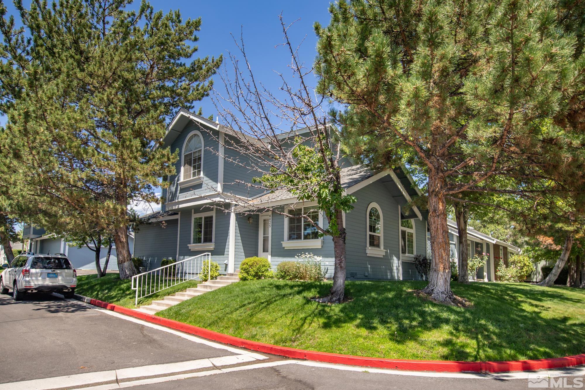 6025 Conness Way Reno, NV 89523 - Photo 1 of 30 a front view of a house with a garden