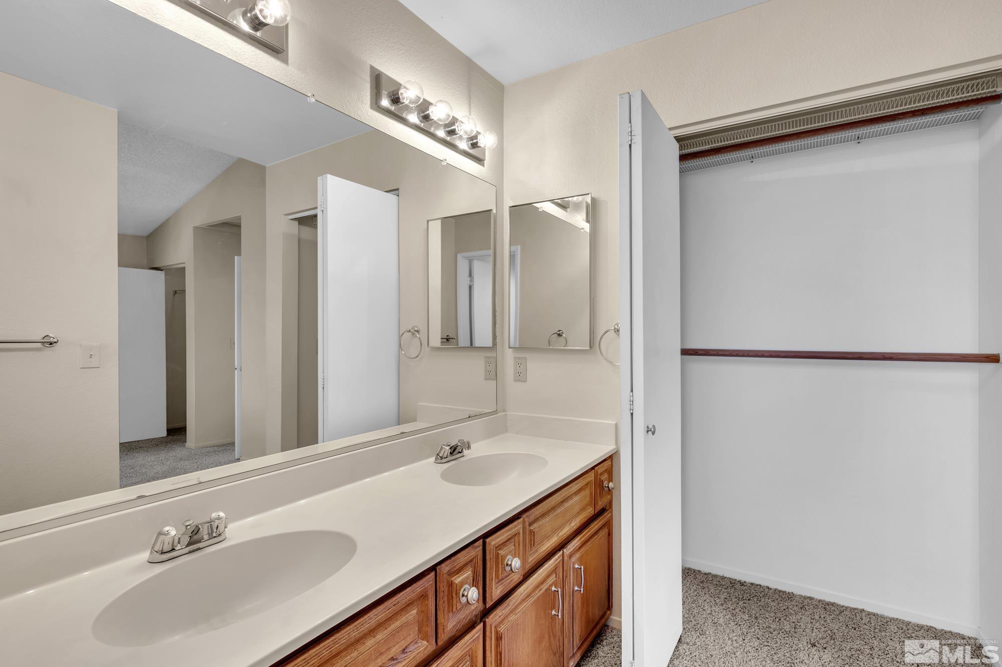 6025 Conness Way Reno, NV 89523 - Photo 22 of 30 a bathroom with a sink and a mirror