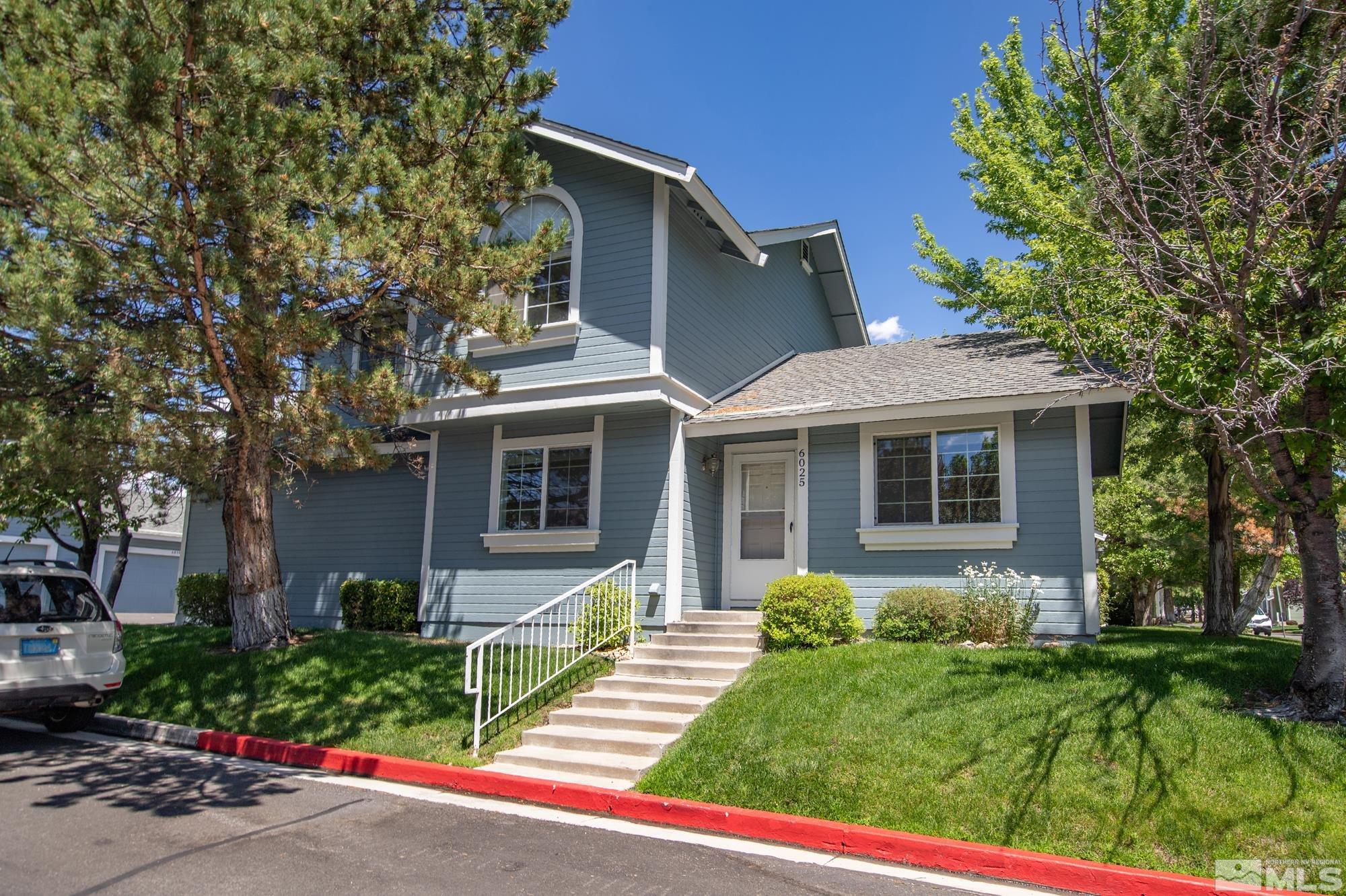 6025 Conness Way Reno, NV 89523 - Photo 3 of 30 a front view of a house with a yard