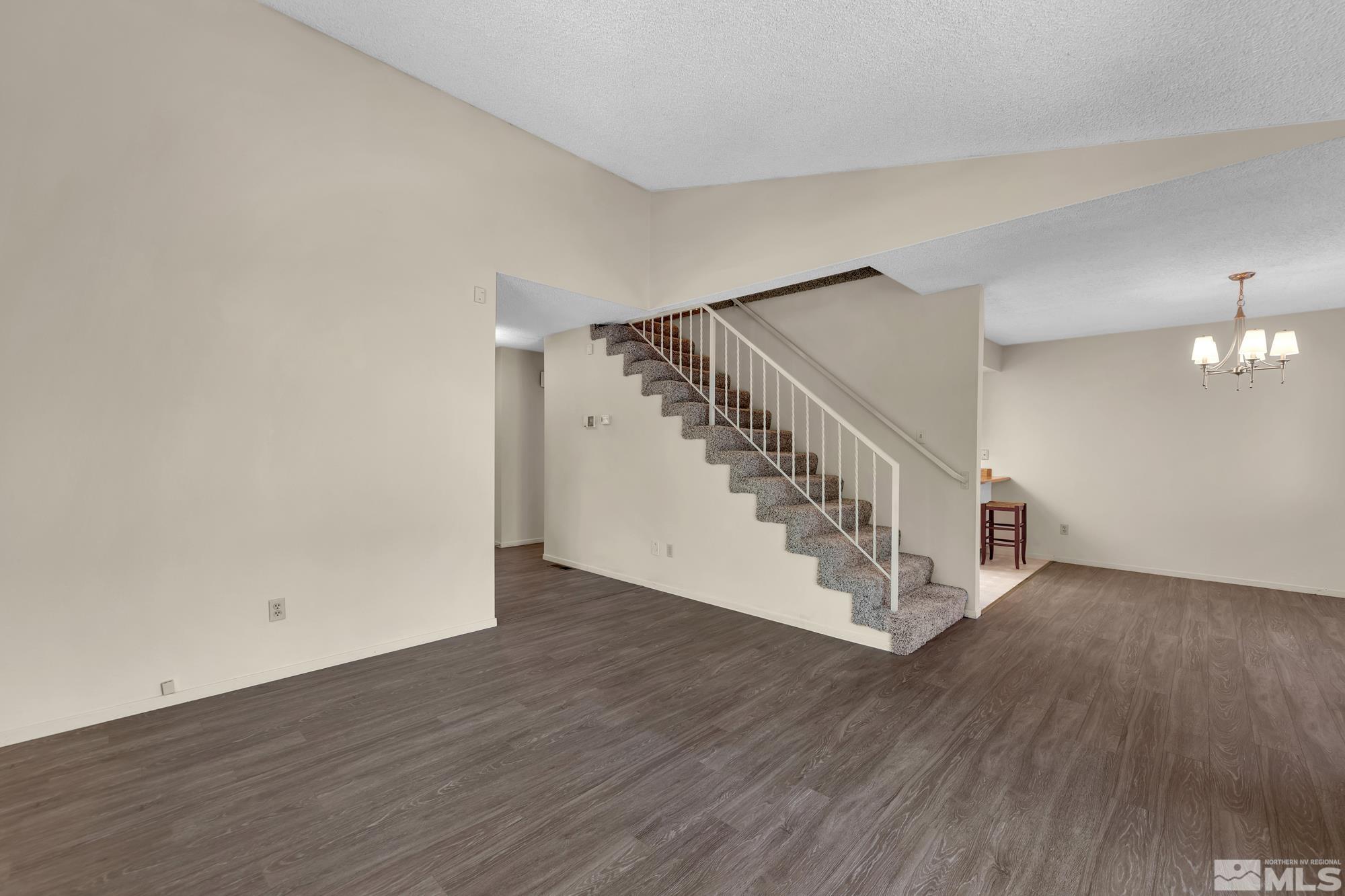 6025 Conness Way Reno, NV 89523 - Photo 9 of 30 a view of an entryway with wooden floor