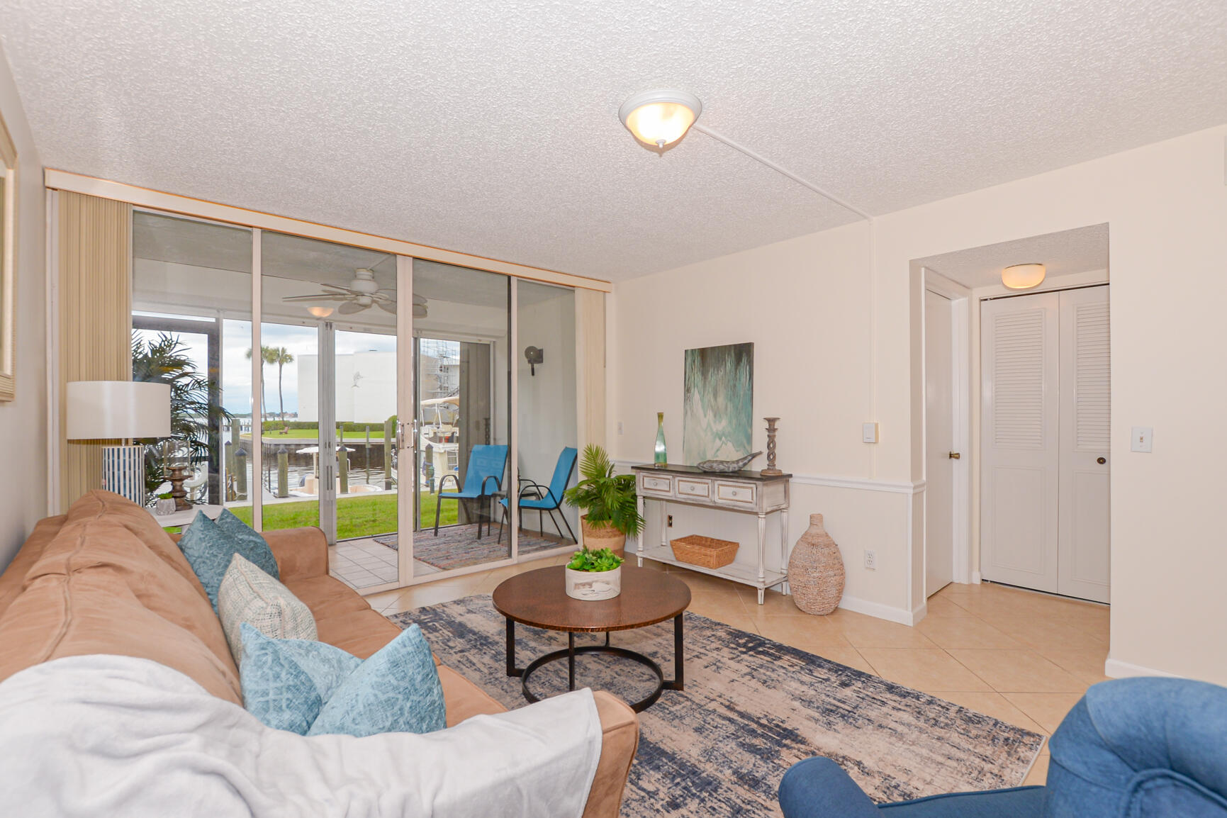 1950 Southwest Palm City Road, Unit 12103 Stuart, FL 34994 - Photo 15 of 26 a living room with furniture and a wooden floor
