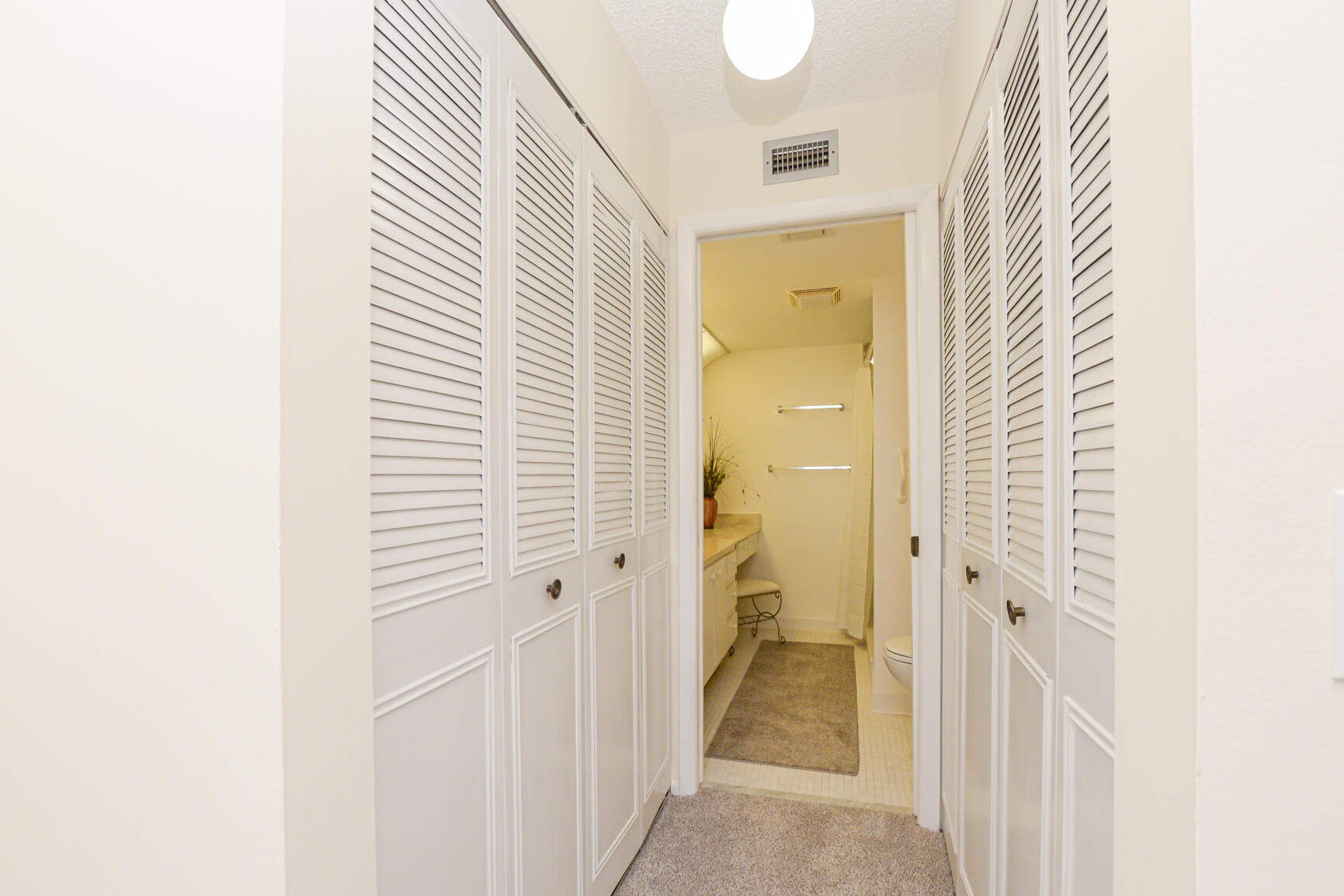 1950 Southwest Palm City Road, Unit 12103 Stuart, FL 34994 - Photo 18 of 26 a view of a bathroom from a hallway