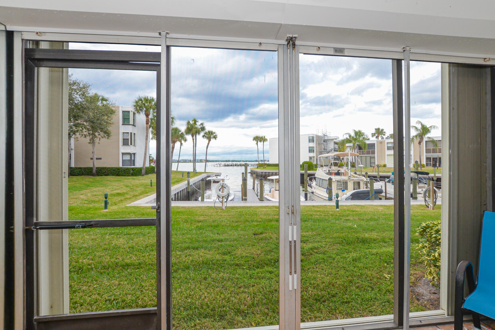1950 Southwest Palm City Road, Unit 12103 Stuart, FL 34994 - Photo 25 of 26 a room with water view and a floor to ceiling window