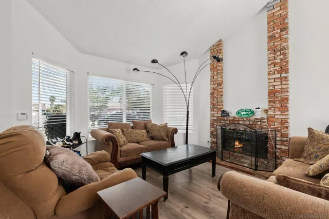 a living room with furniture a couch and a chandelier