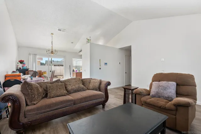 a kitchen with sink a cabinets and potted plant