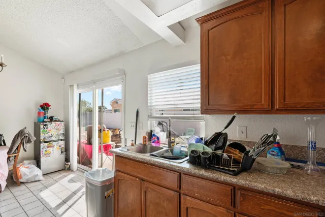 a room with a table chair and a window