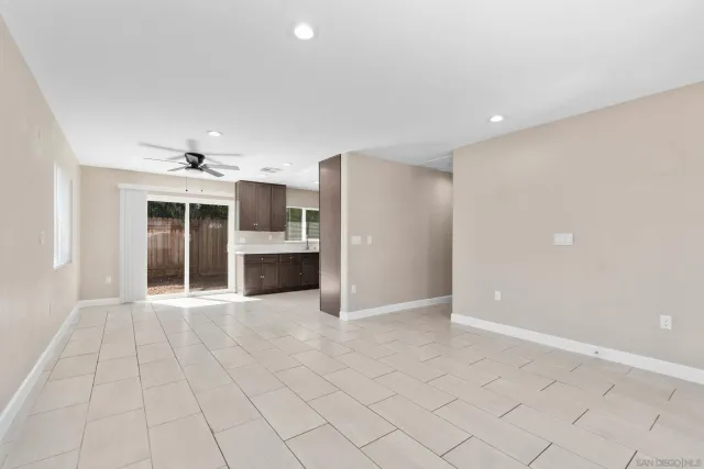 a large kitchen with stainless steel appliances granite countertop a stove a sink and a granite counter tops