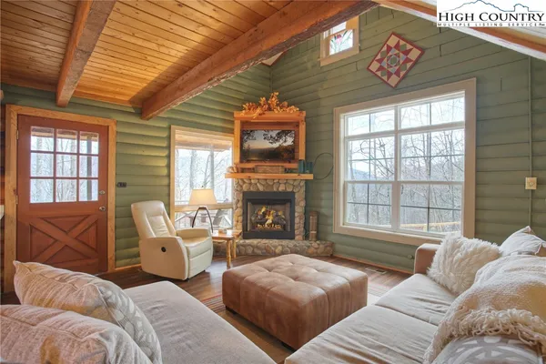 a spacious bedroom with two beds and a large window