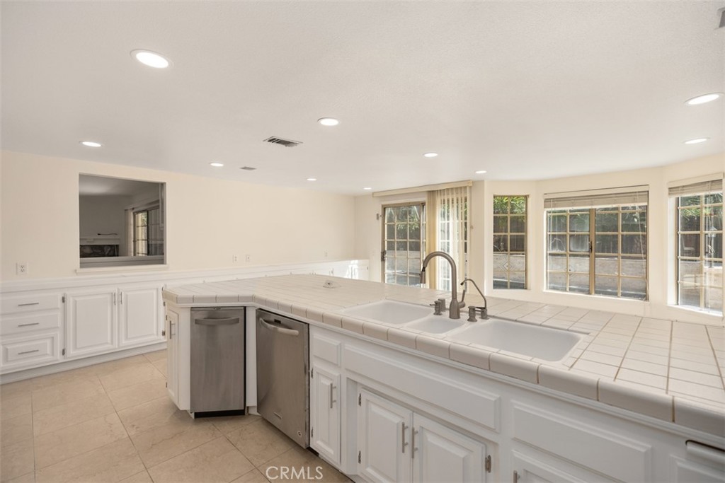21322 Calle Balsa Lake Forest, CA 92630 - Photo 17 of 45 a kitchen with a sink and cabinets