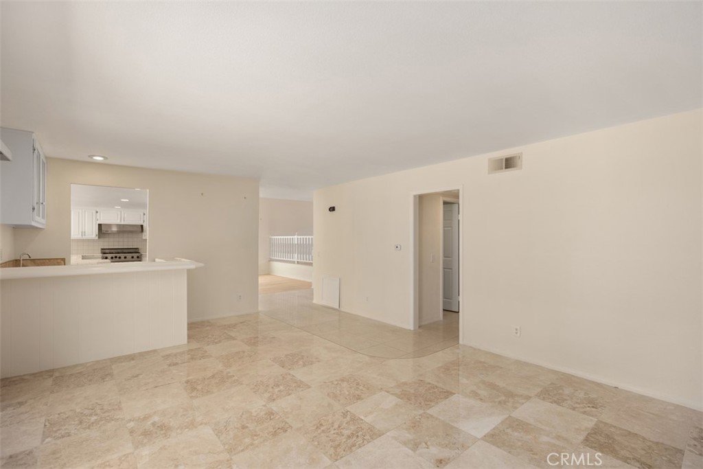 21322 Calle Balsa Lake Forest, CA 92630 - Photo 25 of 45 a view of kitchen with refrigerator stove microwave and cabinets