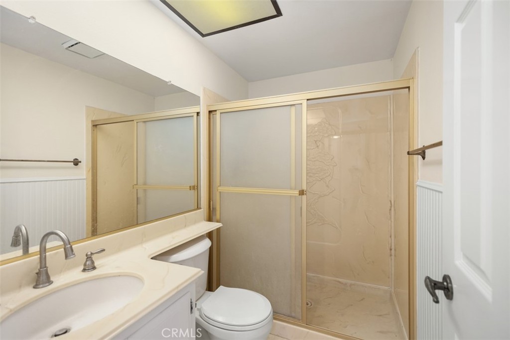 21322 Calle Balsa Lake Forest, CA 92630 - Photo 26 of 45 a bathroom with a sink a toilet and shower