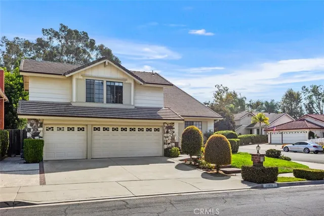a front view of house with yard outdoor seating and barbeque oven