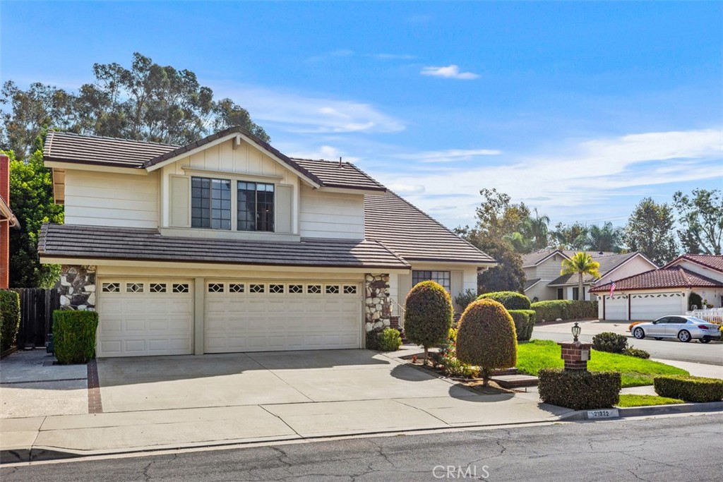 21322 Calle Balsa Lake Forest, CA 92630 - Photo 3 of 45 a front view of house with yard outdoor seating and barbeque oven